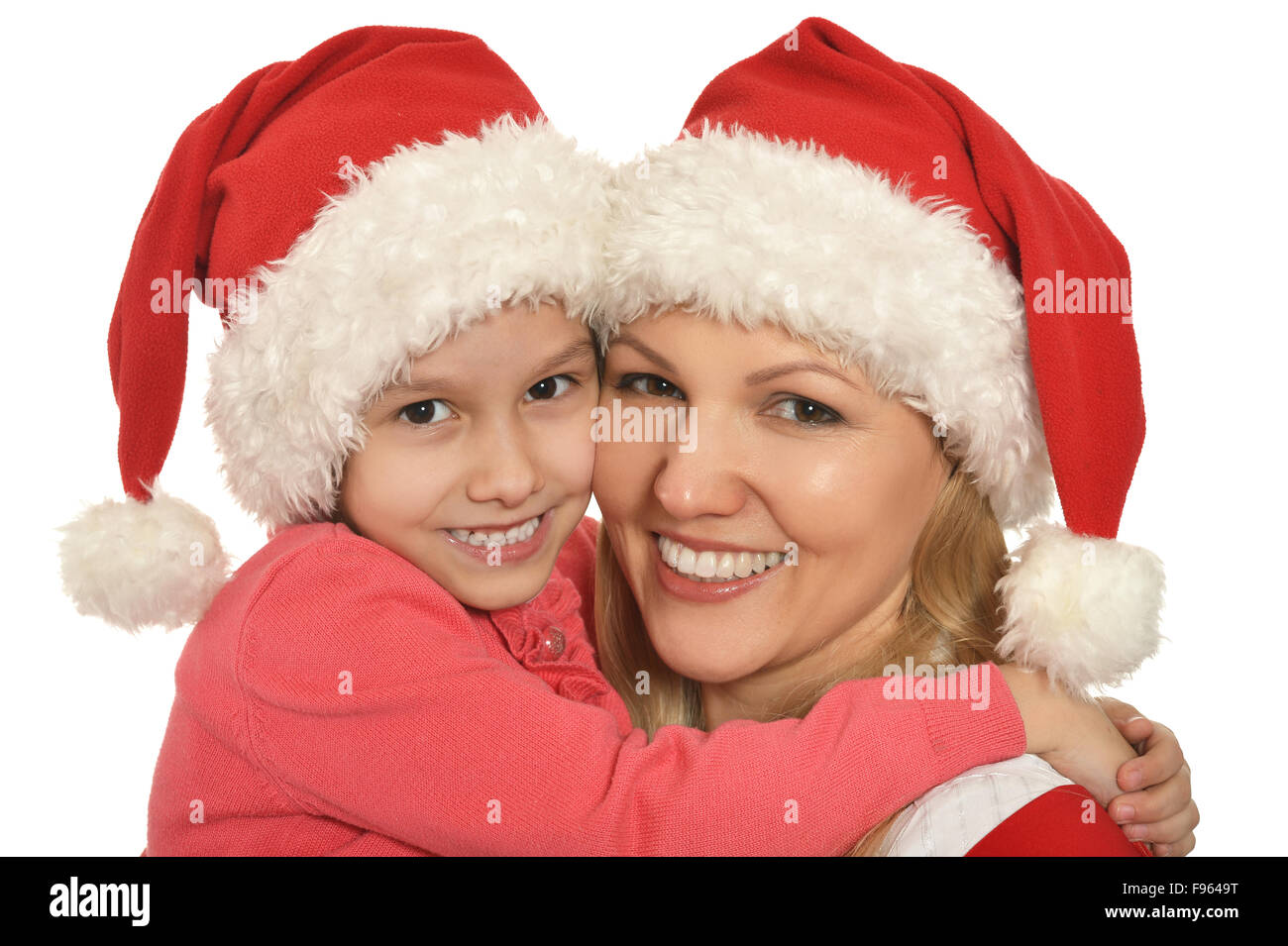 Madre e figlia in tappi di Natale Foto Stock