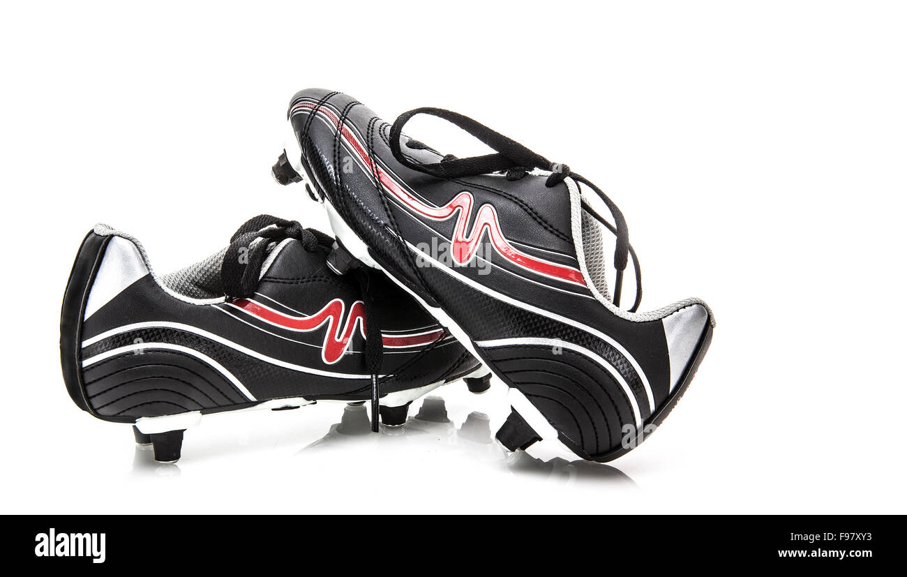 Scarpe da calcio su sfondo bianco Foto Stock