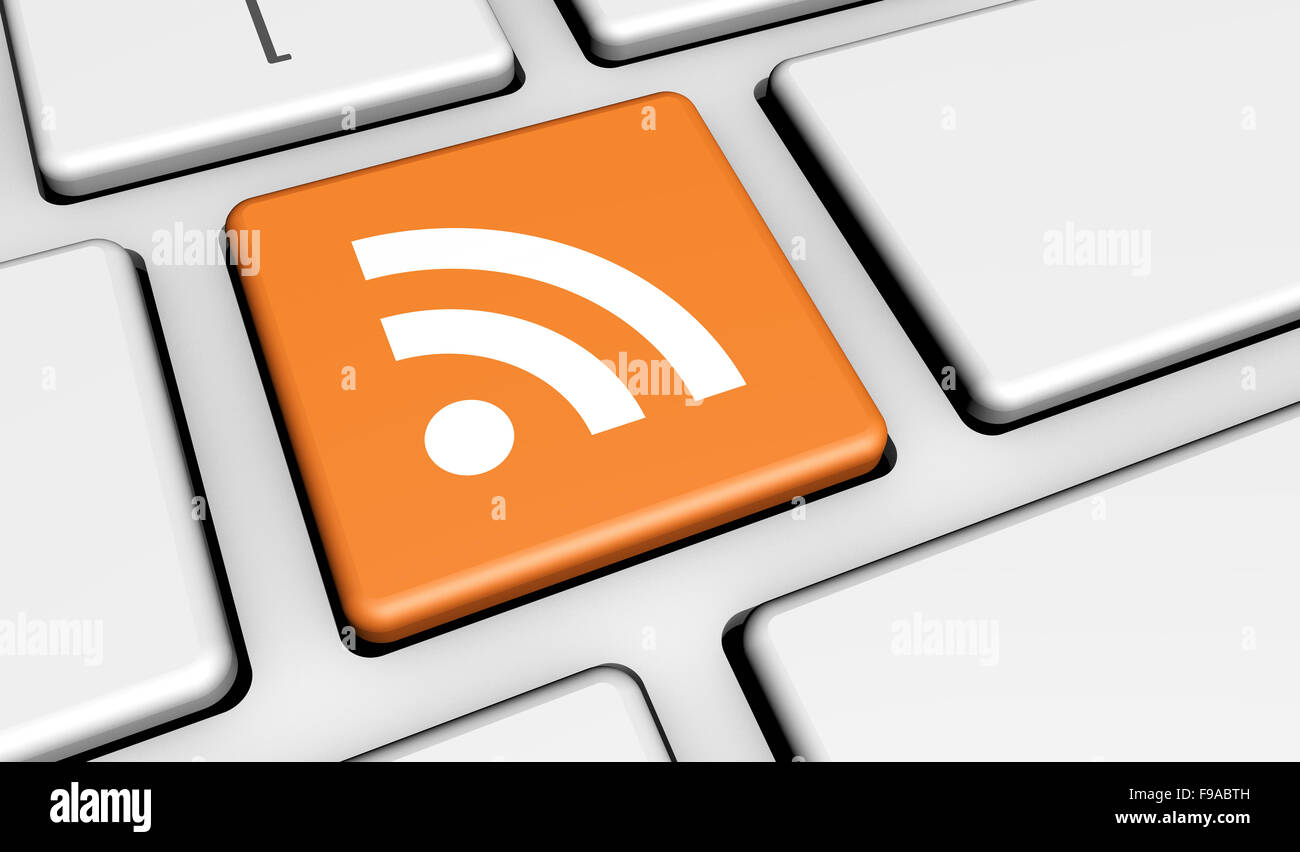 RSS feed web e Internet news concetto con icona e simbolo su un computer portatile chiave per blog e business online. Foto Stock