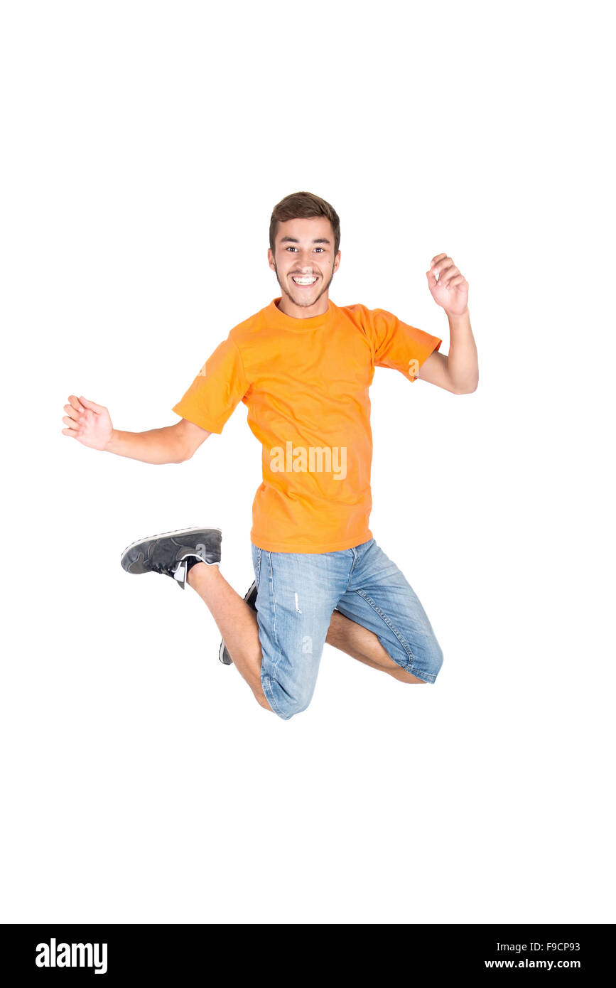 Ragazzo adolescente divertente facendo salti acrobatici isolato in bianco Foto Stock