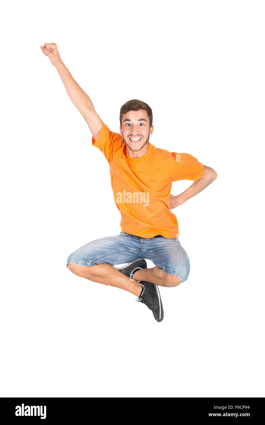 Ragazzo adolescente divertente facendo salti acrobatici isolato in bianco Foto Stock
