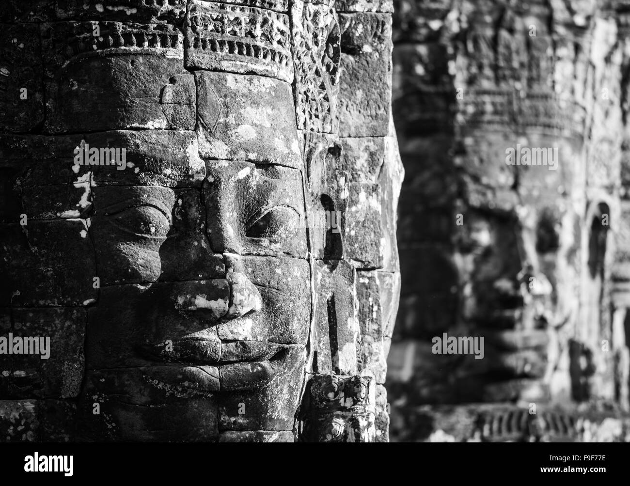 Facce di pietra al tempio Bayon, Angkor, Cambogia Foto Stock
