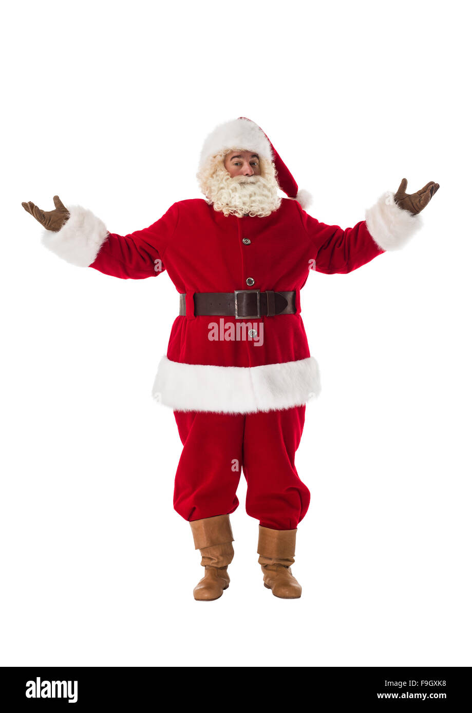 Santa Claus accogliente o presentando a piena lunghezza verticale. Isolato su sfondo bianco Foto Stock