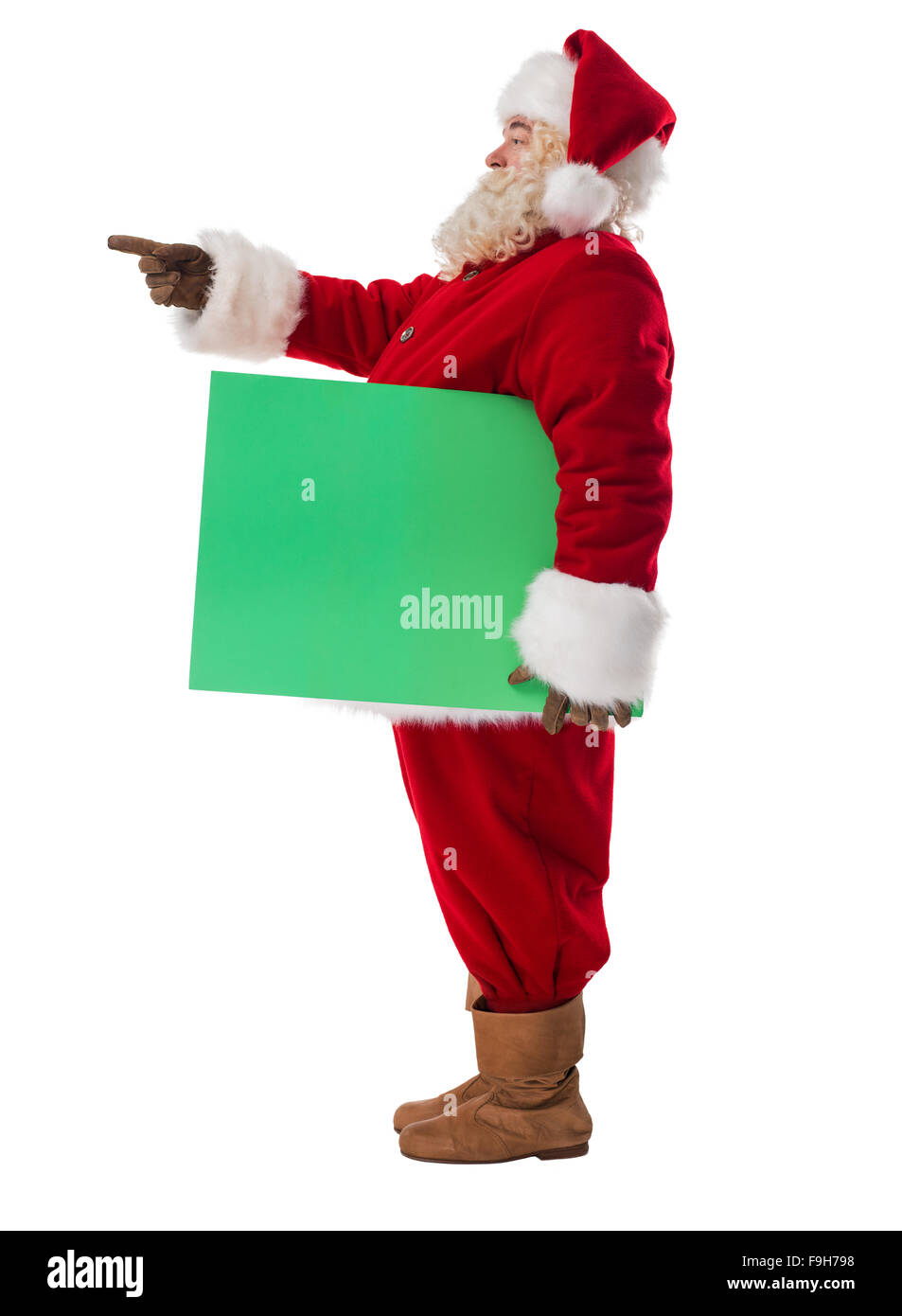 Santa Claus azienda verde segno bianco a piena lunghezza verticale. Isolato su sfondo bianco Foto Stock