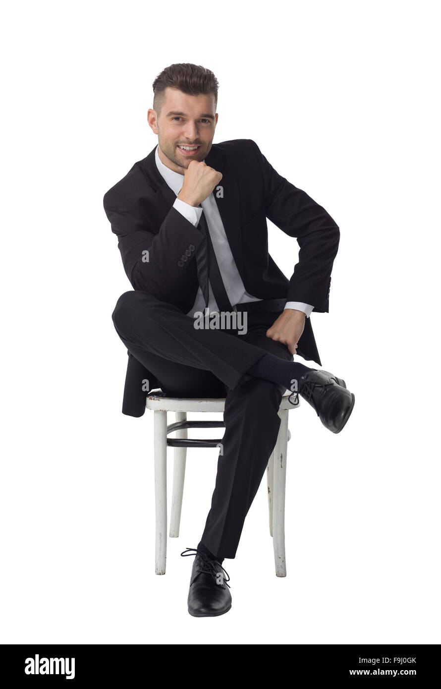 Imprenditore seduti su una sedia e pensando a piena lunghezza Ritratto isolato su sfondo bianco Foto Stock