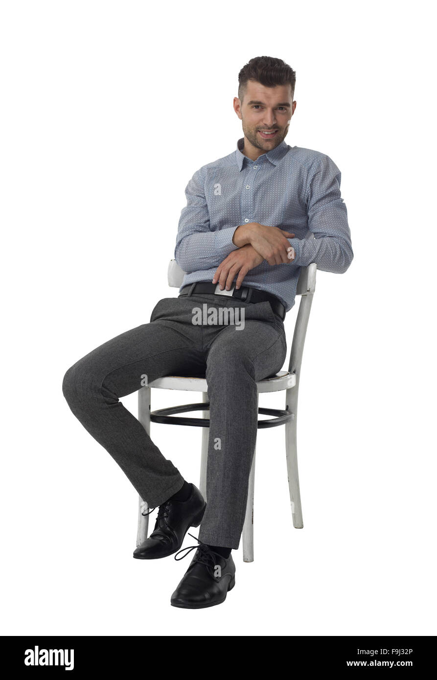 Imprenditore seduti su una sedia e pensando a piena lunghezza Ritratto isolato su sfondo bianco Foto Stock