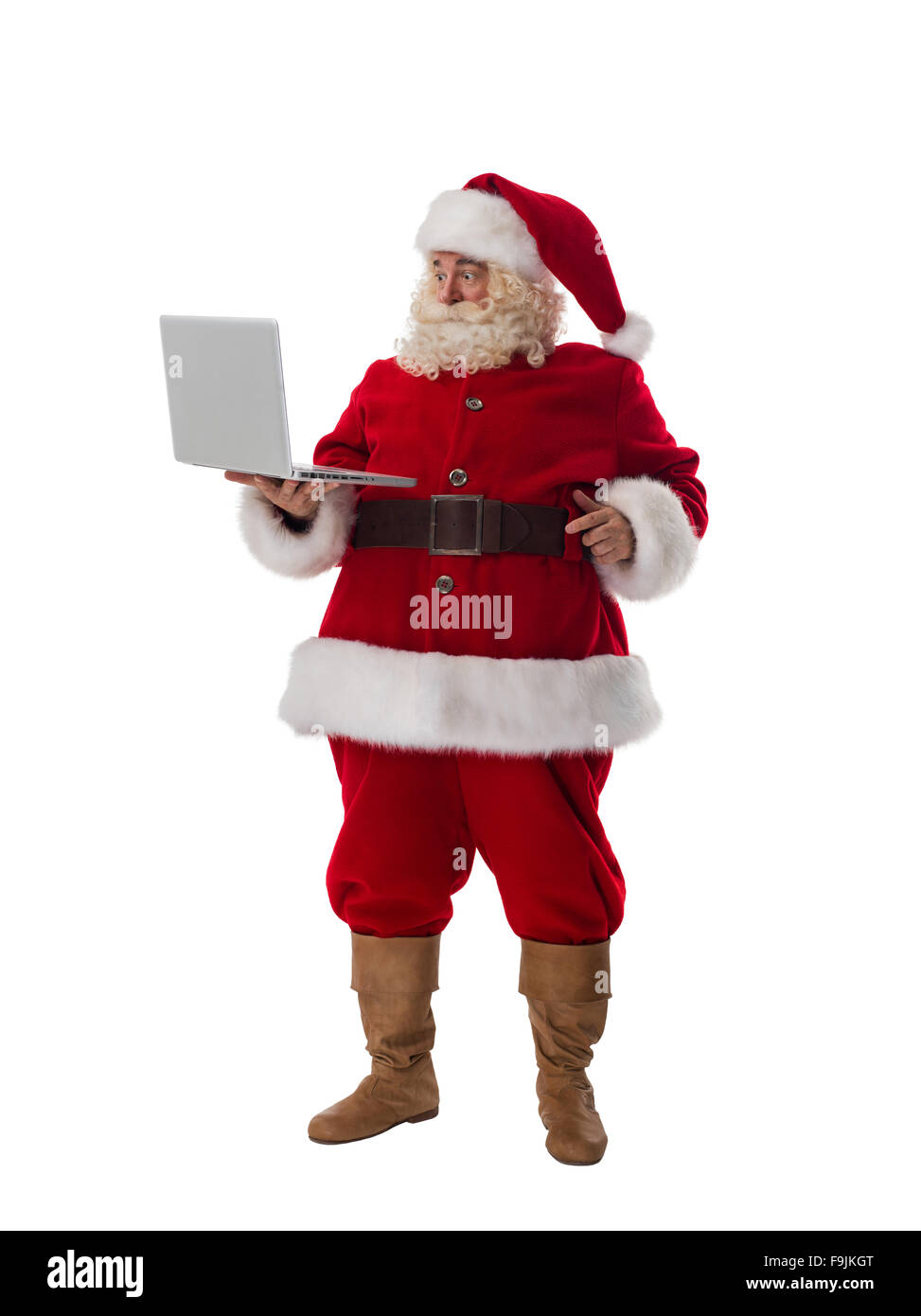 Babbo Natale con il computer portatile a piena lunghezza Ritratto isolato su sfondo bianco Foto Stock