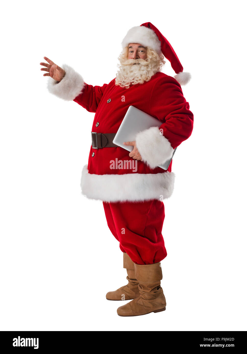 Babbo Natale con il computer portatile a piena lunghezza Ritratto isolato su sfondo bianco Foto Stock