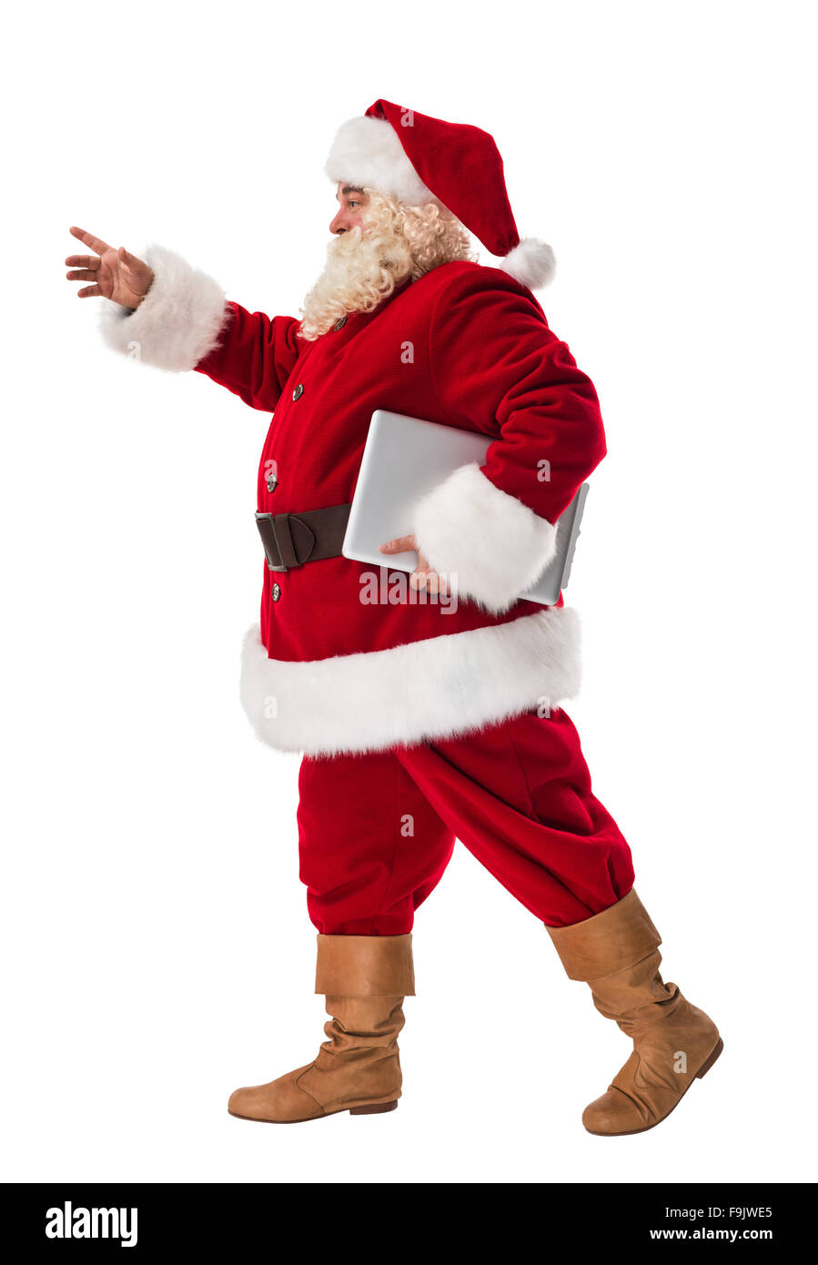 Santa Claus holding laptop a piena lunghezza Ritratto isolato su sfondo bianco Foto Stock