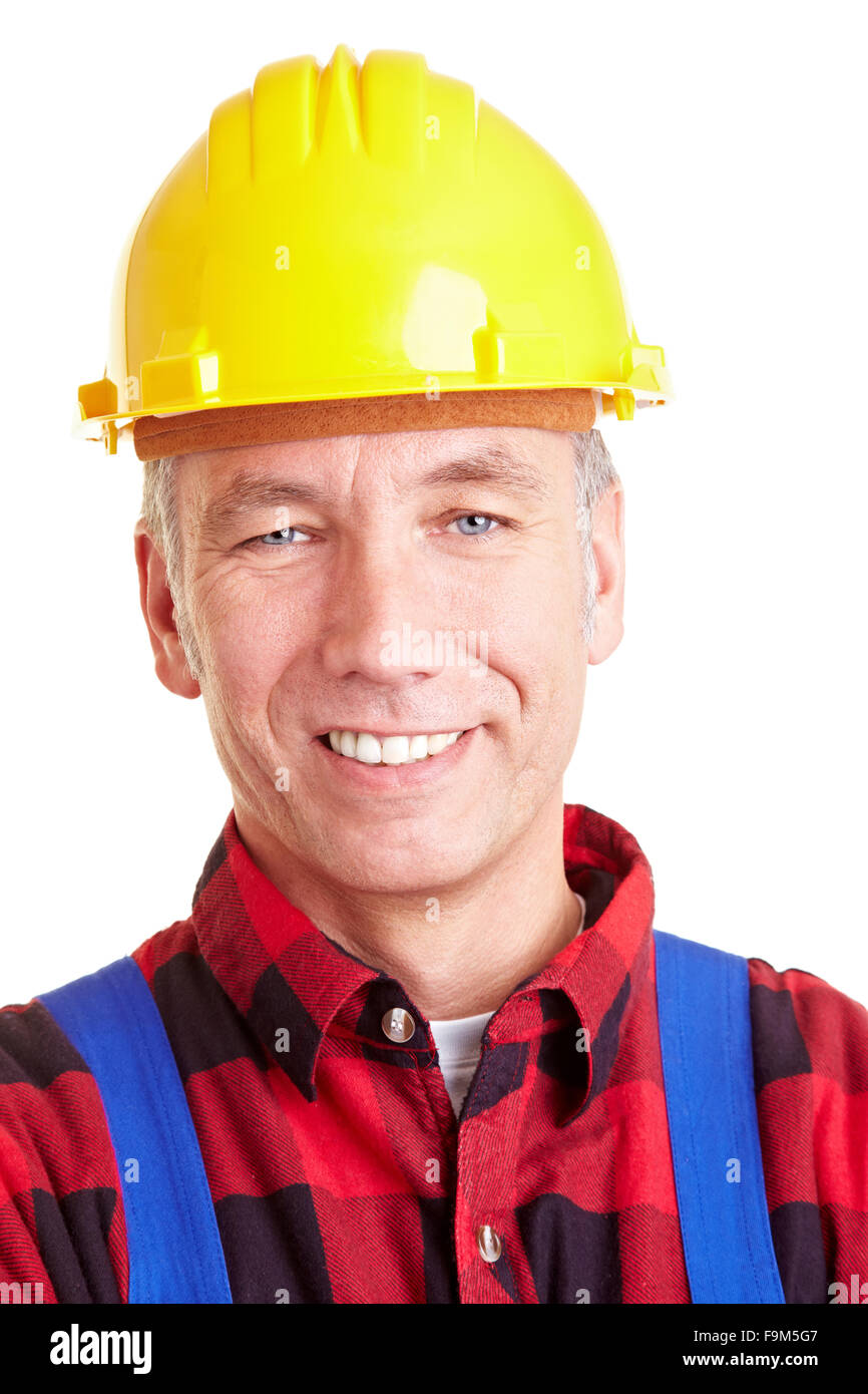 Ritratto di un sorridente lavoratore edile con elmetto Foto Stock