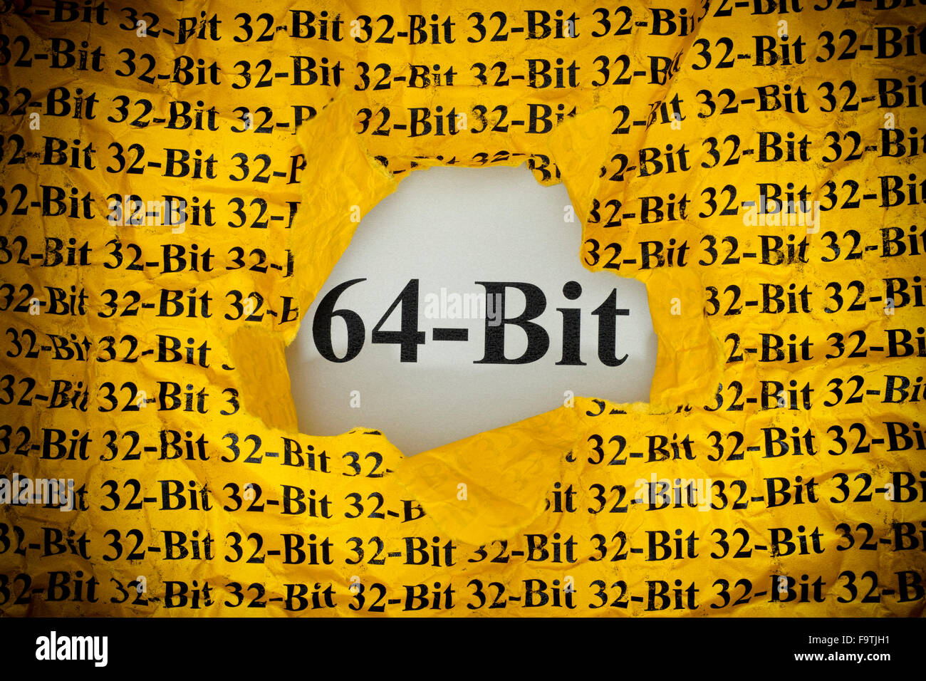 Tempo per 64-bit. 64-Bit che appaiono dietro strappata 32-Bit carta gialla. Foto Stock