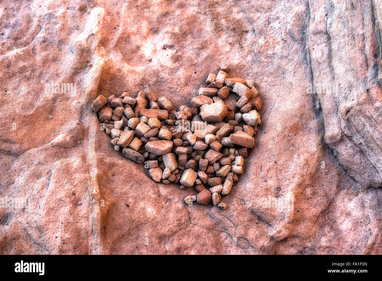 Piccole rocce formate in forma di cuore. Foto Stock