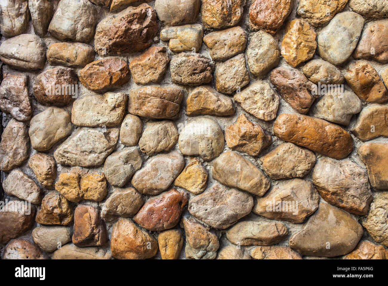 Muro di pietra Texture di forme diverse di pietre simili a parete . Foto Stock