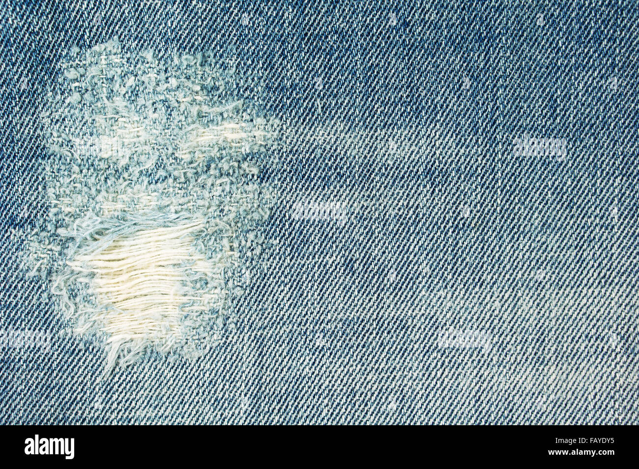 Jeans strappati texture e lo sfondo Foto Stock