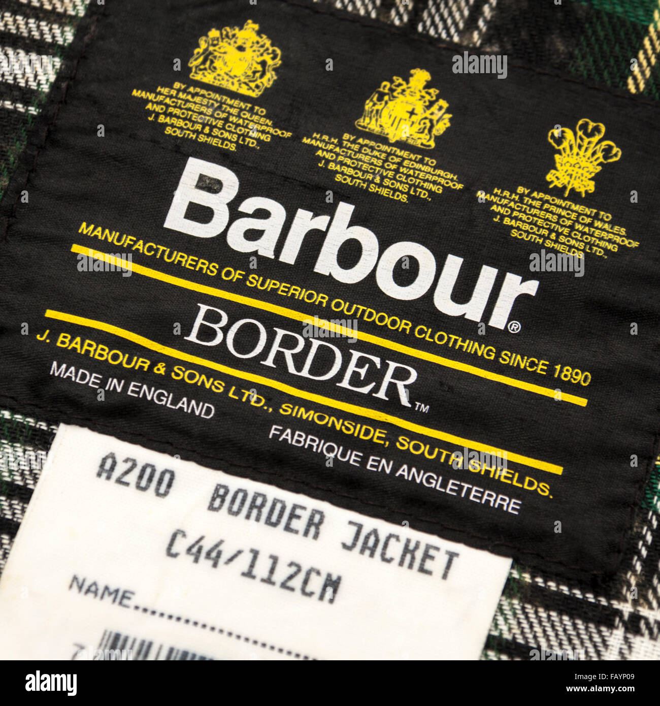 Etichetta all'interno di un Barbour A200 Confine cerata giacca, con il sigillo reale di approvazione. Foto Stock