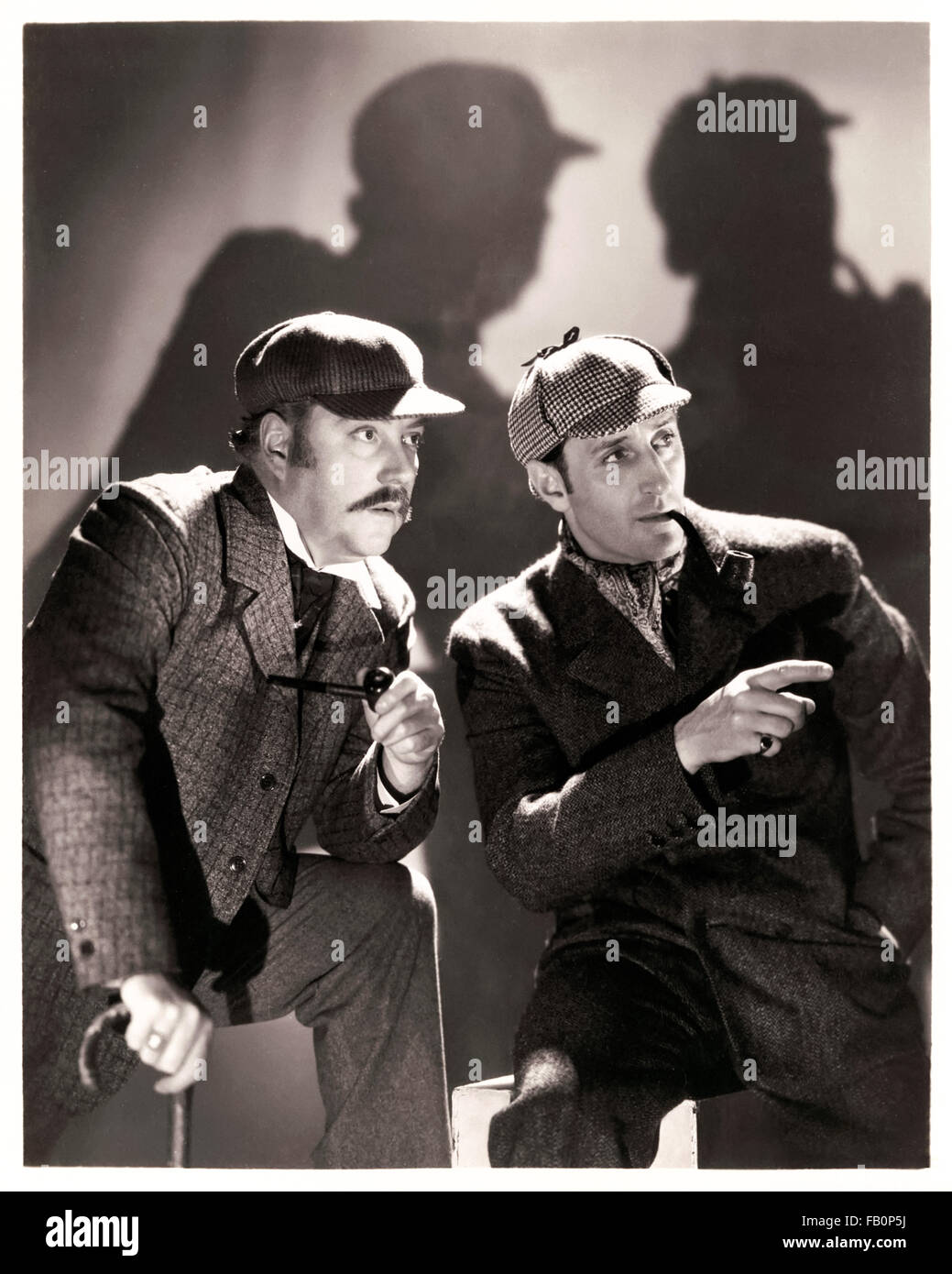 'L'Hound del Baskervilles' 1939 pubblicità ancora per il film diretto da Sidney Lanfield e interpretato da Basil Rathbone come Sherlock Holmes e Nigel Bruce come Doctor Watson. Vedere la descrizione per maggiori informazioni. Foto Stock