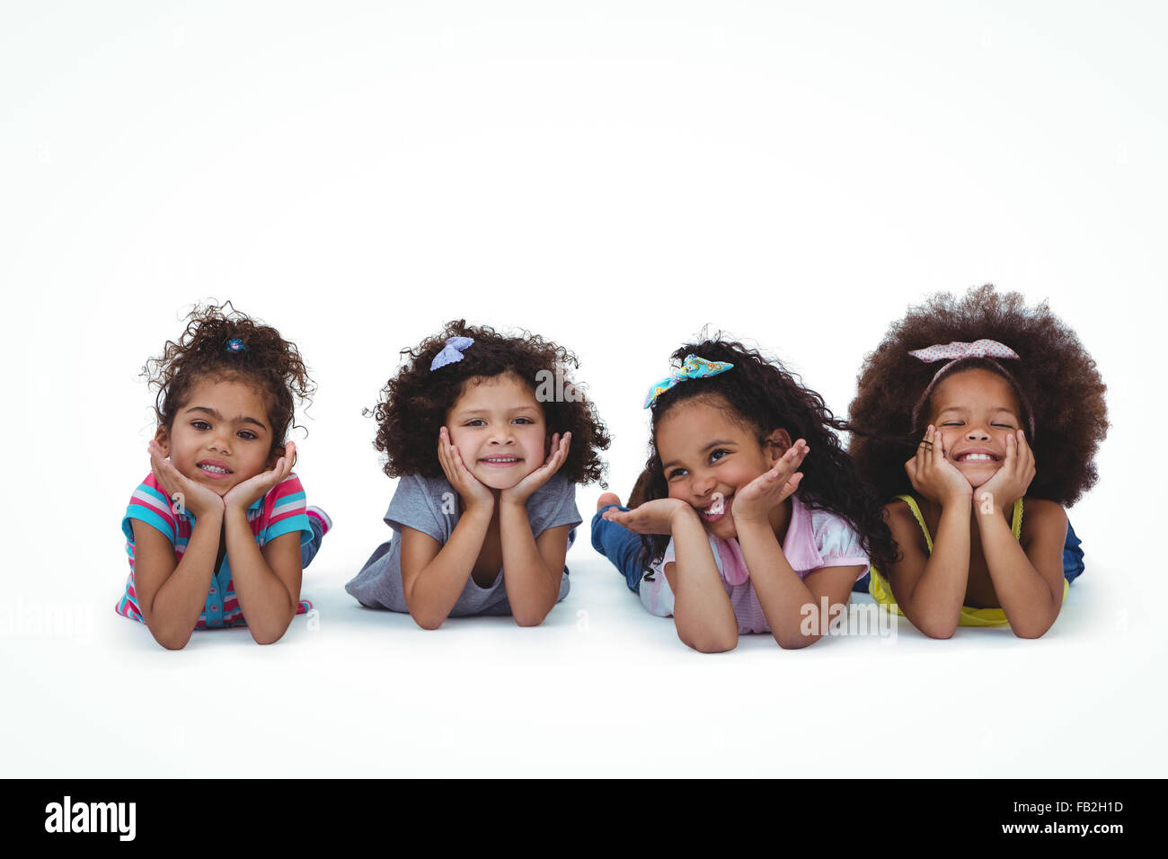 Cute ragazze posa sul pavimento con la testa sulle mani Foto Stock