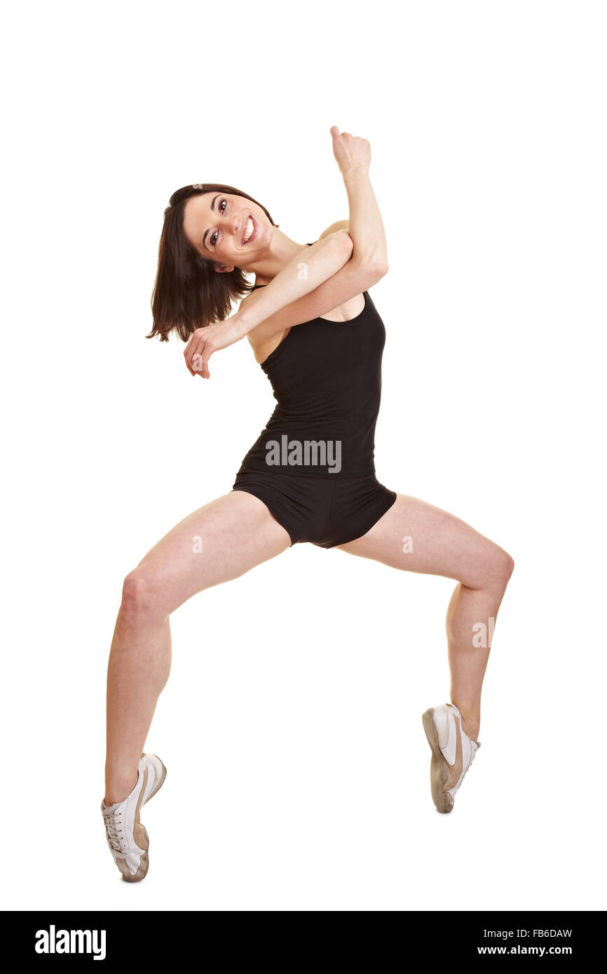 Giovani sorridente dancing ballerina permanente sulla tiptoes Foto Stock