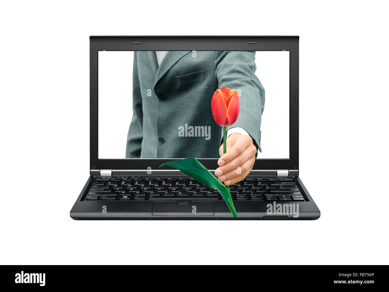 Persona dà un fiore dal monitor Foto Stock