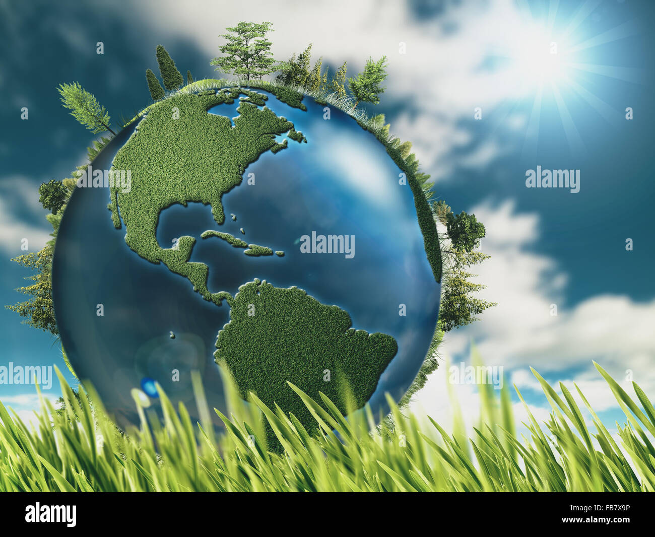 Eco sfondi naturali con globo terrestre ed erba verde Foto Stock