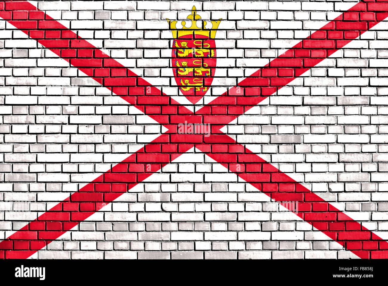 Bandiera del Jersey dipinta su un muro di mattoni Foto Stock