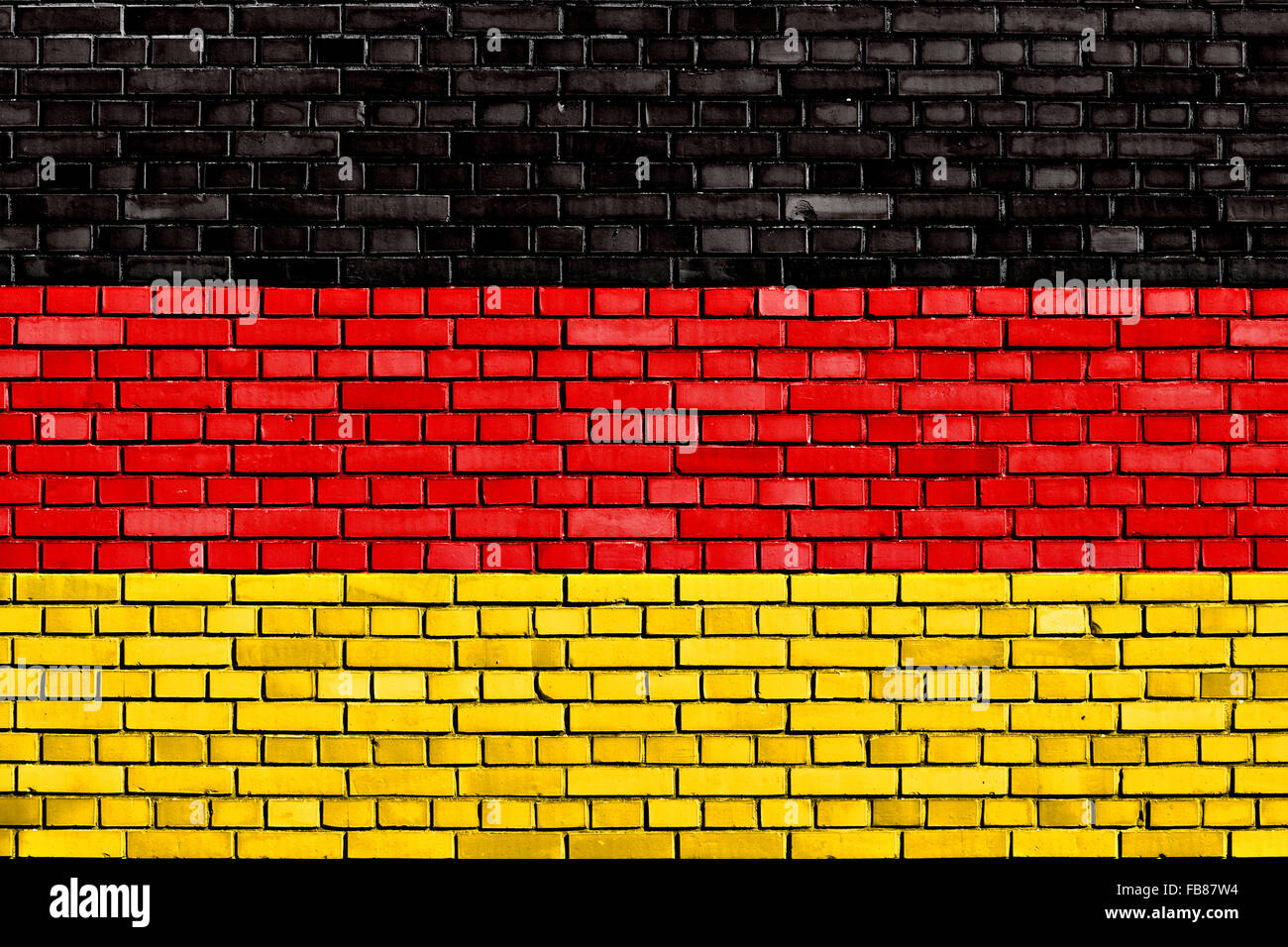 Bandiera della Germania dipinta su un muro di mattoni Foto Stock