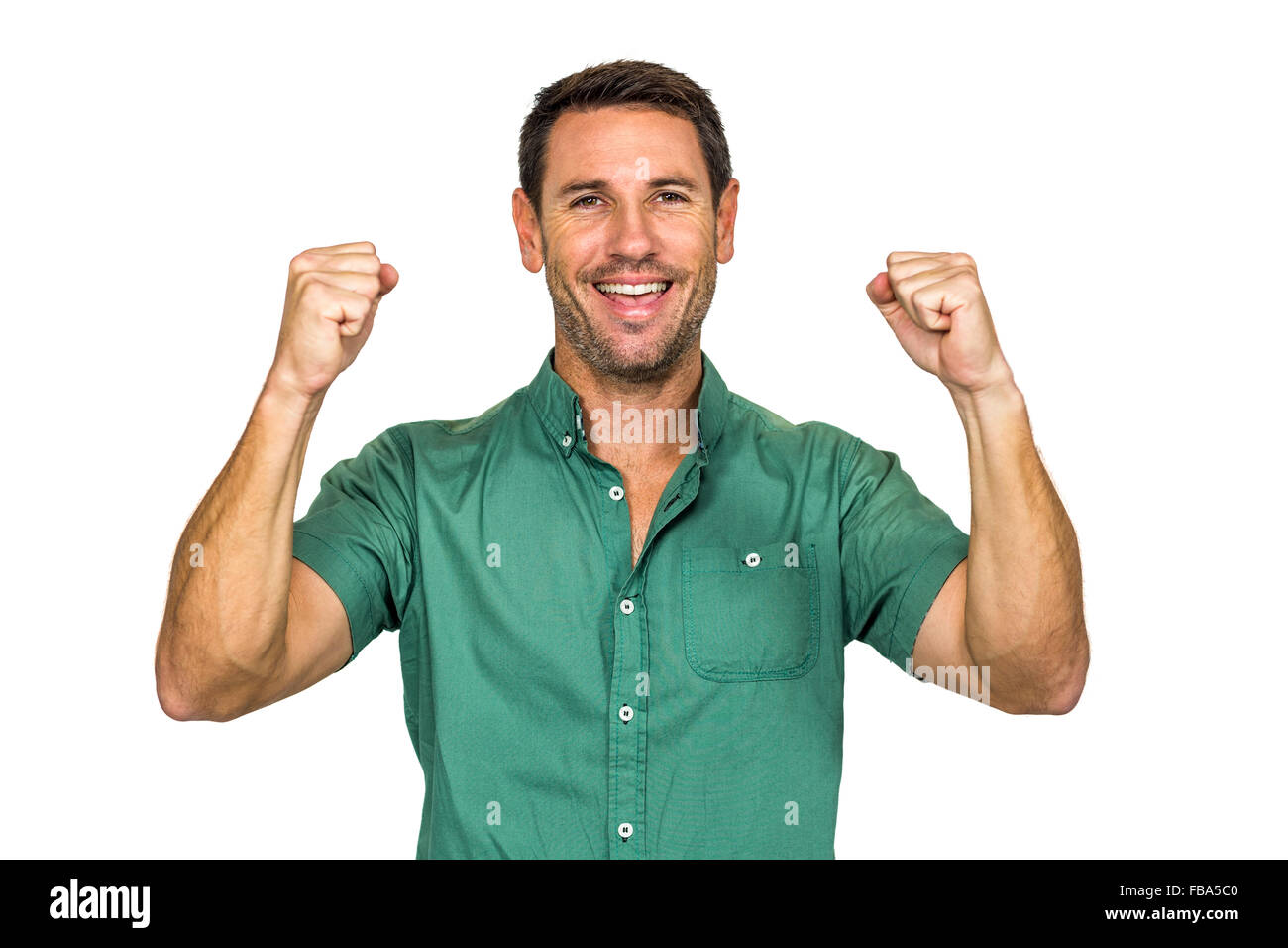 Uomo felice esultanza il sollevamento a suon di pugni Foto Stock