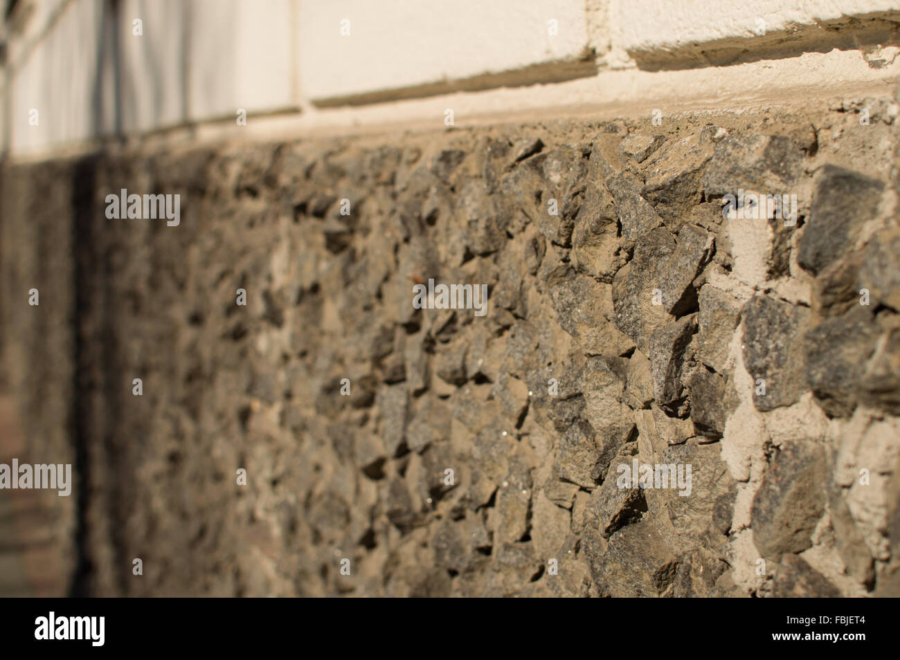 Pietra Grezza parete decorativa. Vecchio edificio Foto Stock