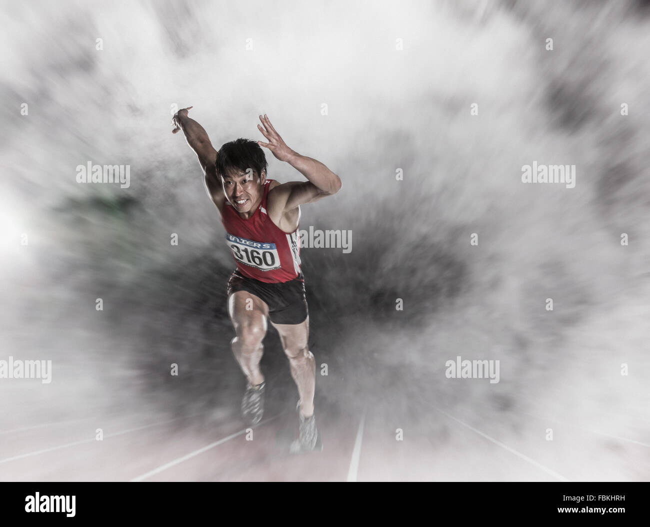 Giapponese atleta maschio in esecuzione Foto Stock