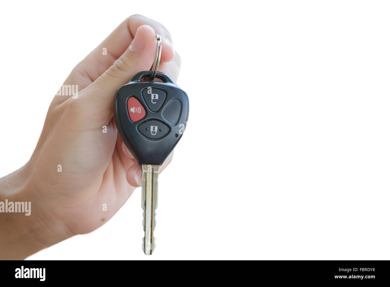 Mano che tiene il controllo remoto di un'auto, chiave con sistema di allarme, isolare lo sfondo bianco, uno spazio vuoto Foto Stock