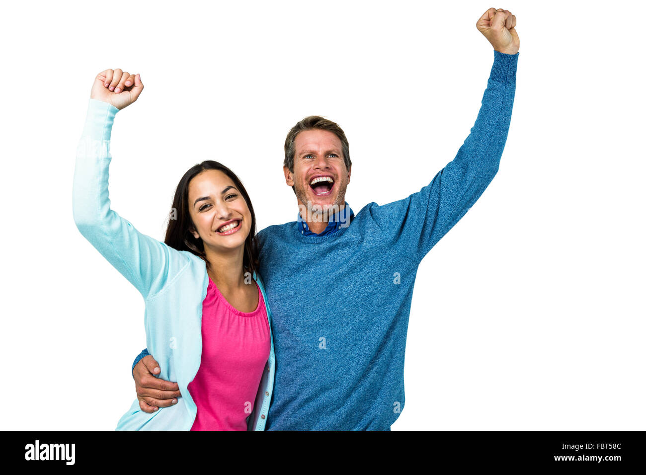 Coppia di successo con le mani alzate Foto Stock