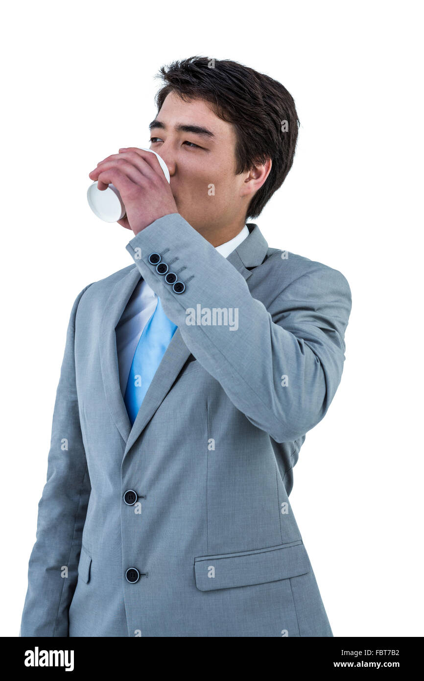 Imprenditore asiatico di bere il caffè Foto Stock