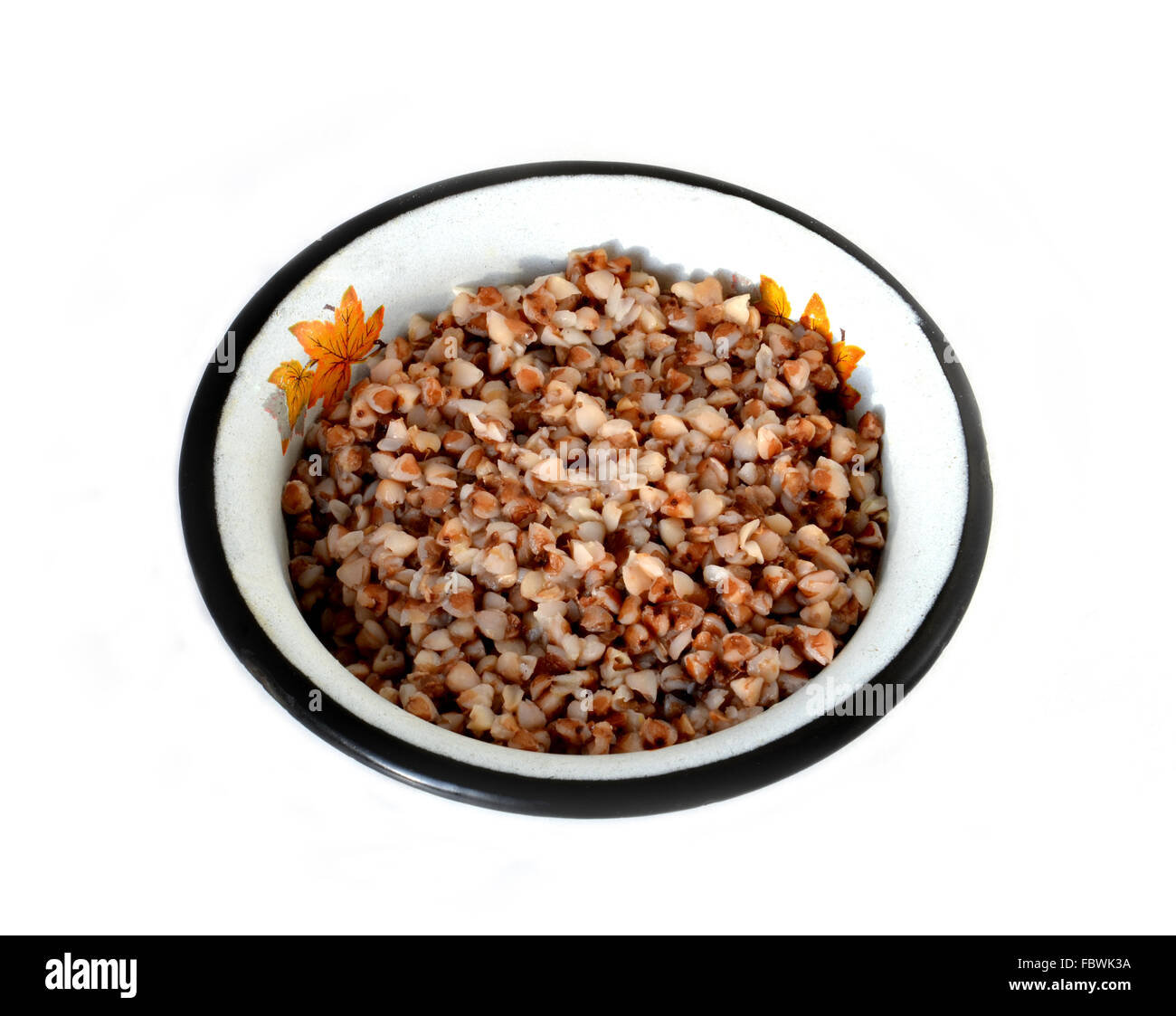 Il cuocere il grano saraceno in una piastra di metallo Foto Stock
