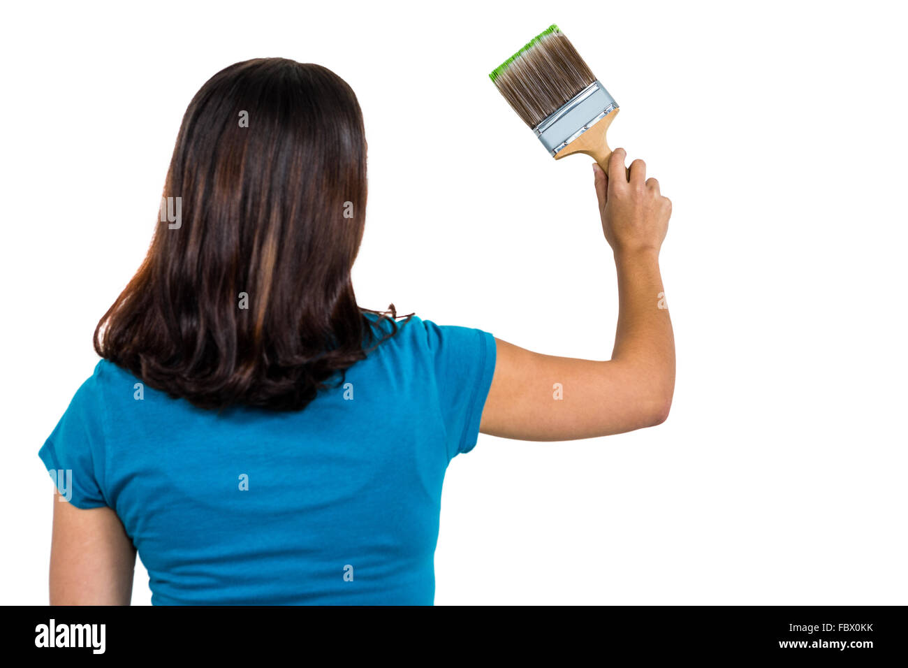 Vista posteriore della donna tenendo un pennello Foto Stock