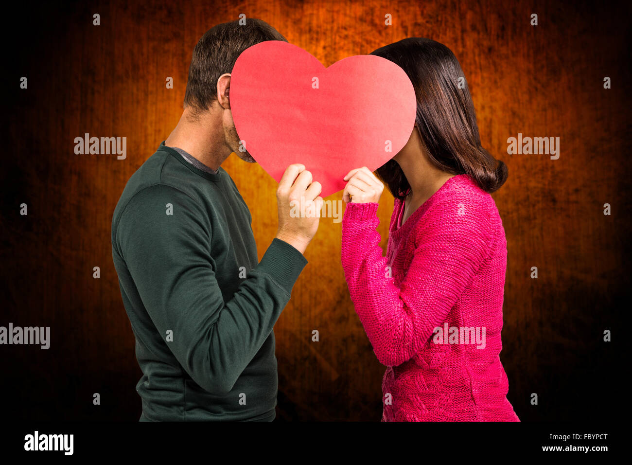 Immagine composita della coppia facce di copertura a forma di cuore Foto Stock