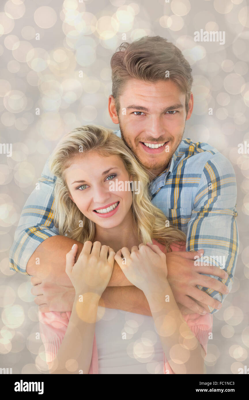 Immagine composita di attraente giovane coppia sorridente in telecamera Foto Stock