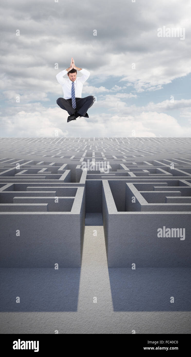 Immagine composita di imprenditore in seduta lotus posano con le mani insieme Foto Stock