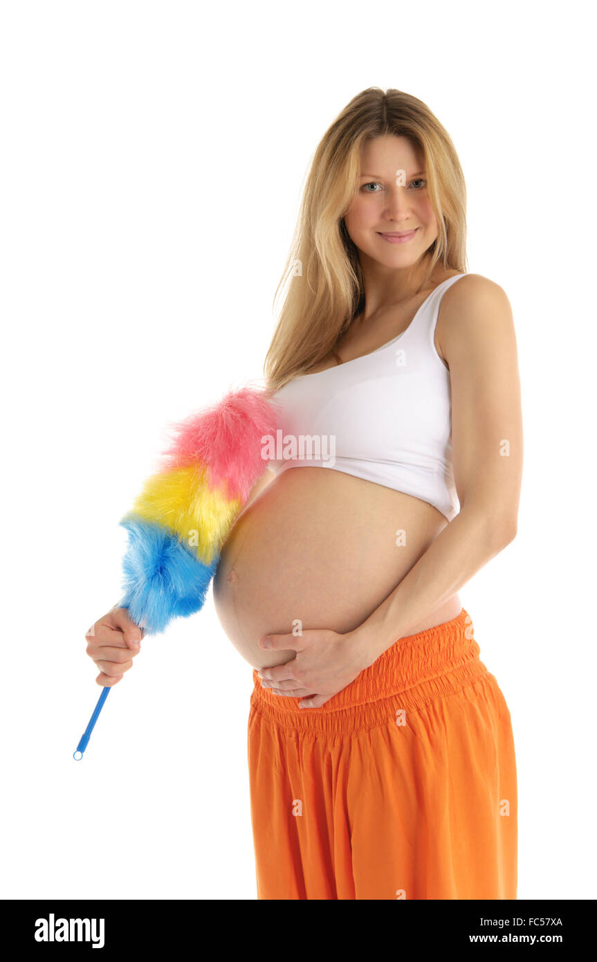 Donna incinta con spazzola Foto Stock