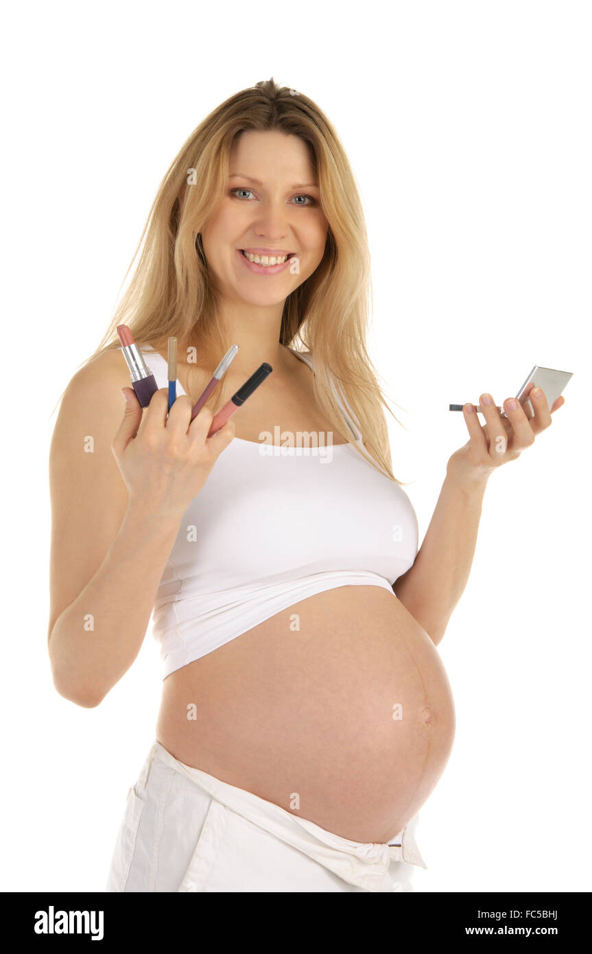 Donna incinta con il trucco Foto Stock
