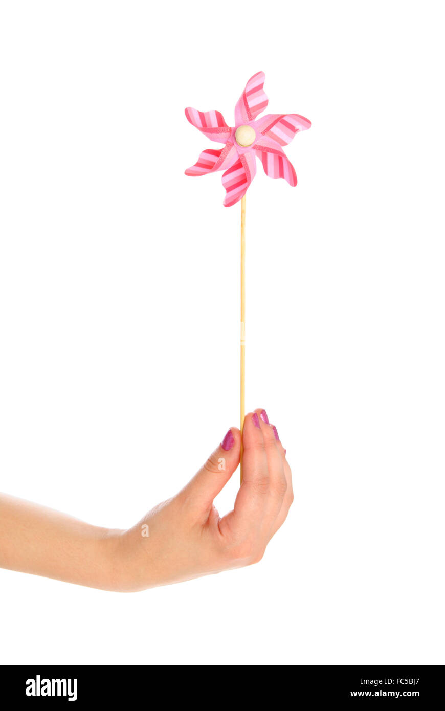 Mano con toy banderuola Foto Stock