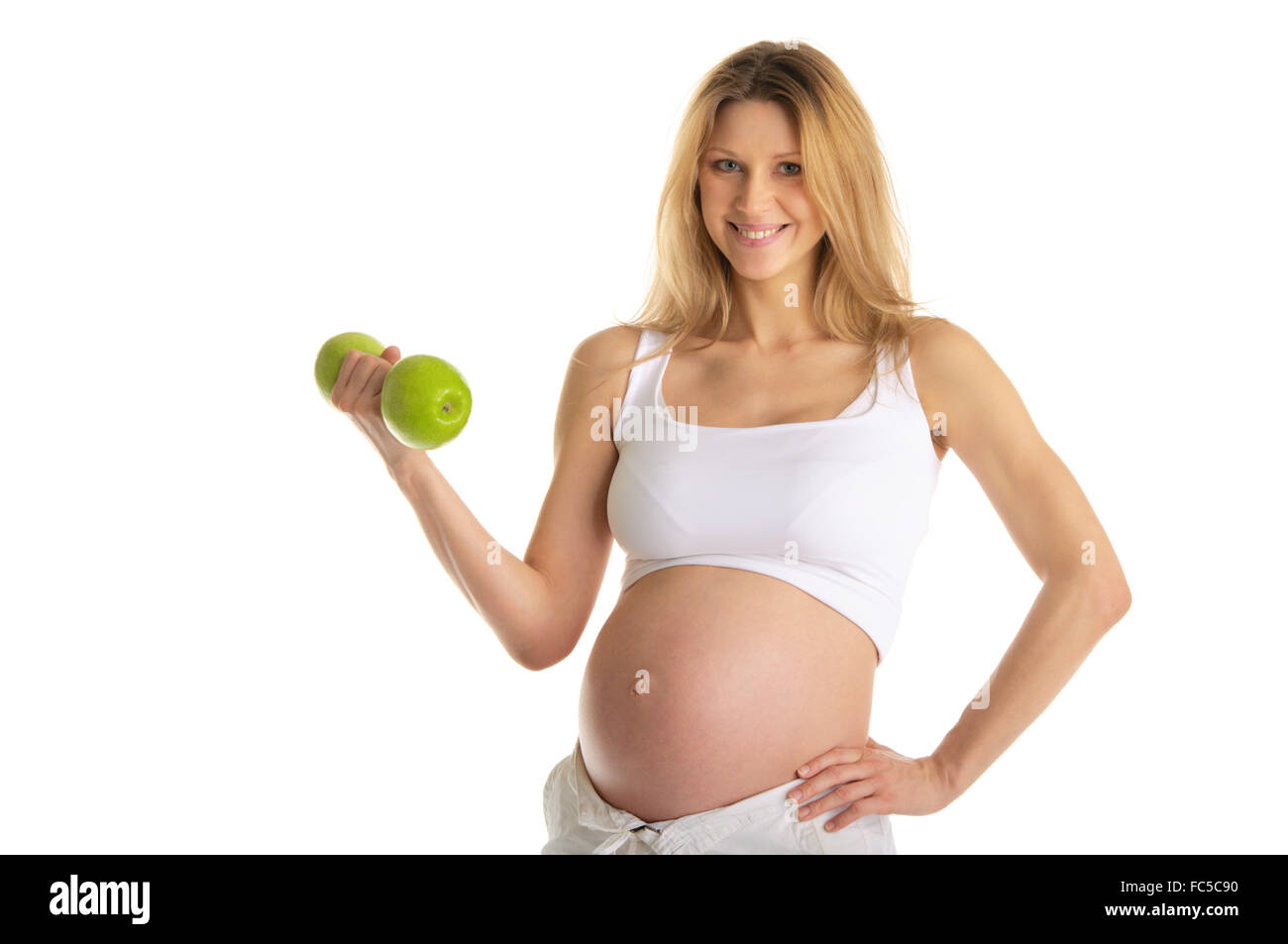 Donna incinta coinvolta nel fitness Foto Stock