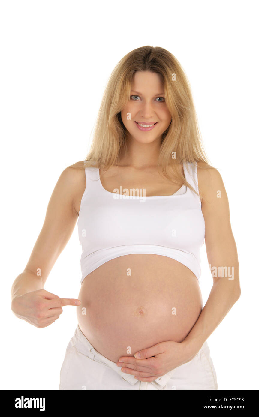 Donna incinta mostra il suo stomaco Foto Stock