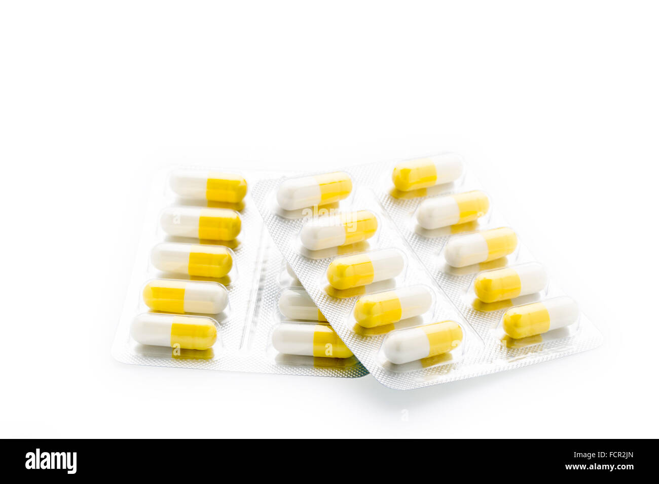 Capsule giallo pillola confezione in blister Foto Stock