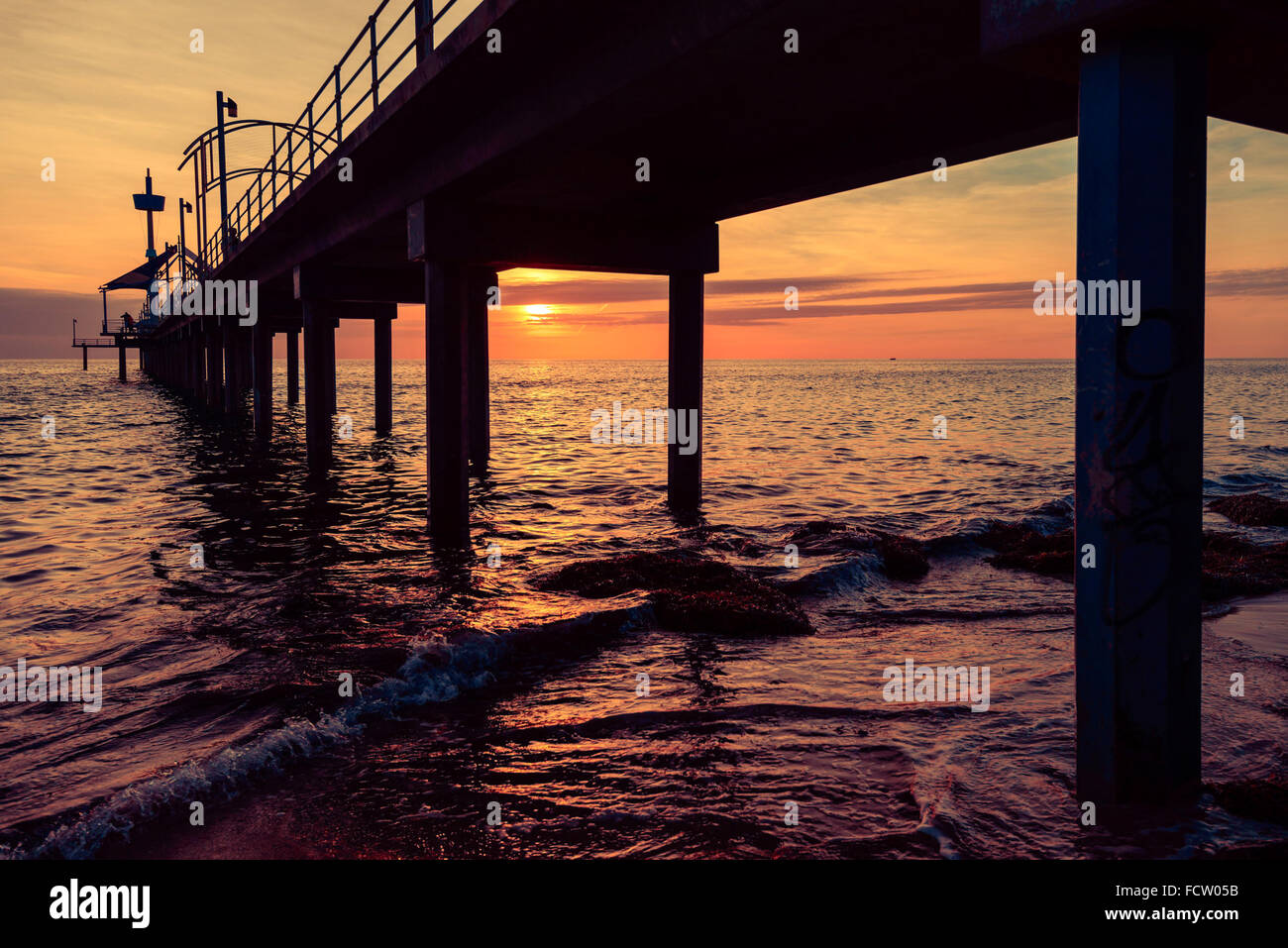 Molo di Brighton tramonto, South Australia. Colore effetti tonificanti applicato Foto Stock