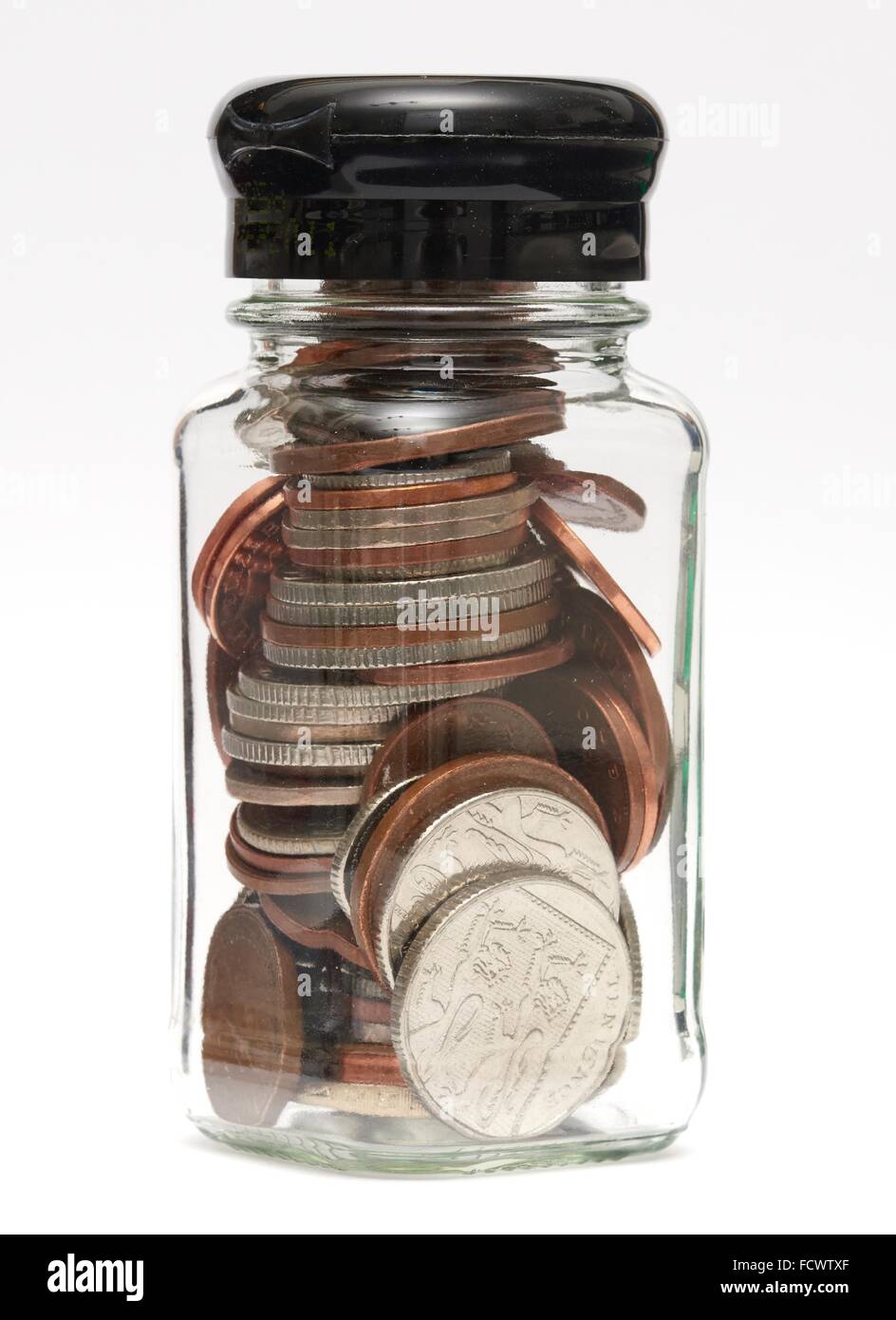 Un piccolo bicchiere di risparmio di denaro jar Foto Stock