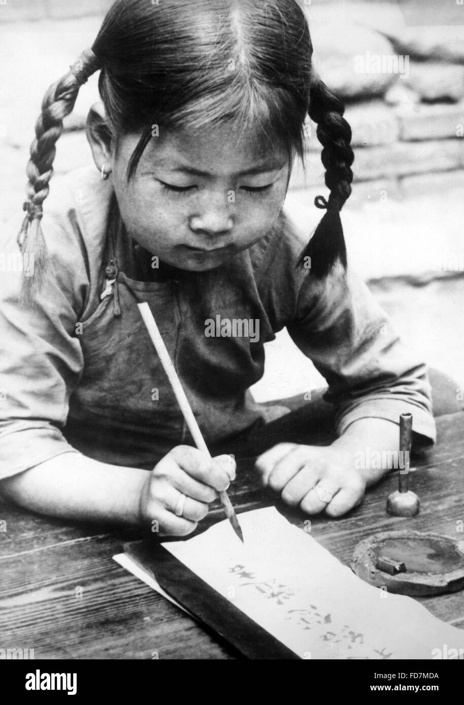 Ragazza Cinese scrittura, 1940 Foto Stock