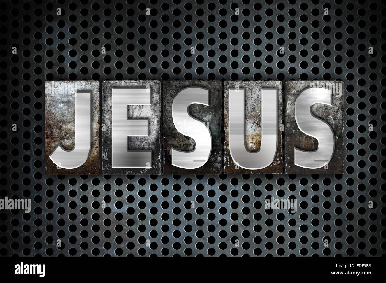 La parola Gesù scritto in metallo vintage tipo di stampa in rilievo su un industriale nero lo sfondo della griglia. Foto Stock