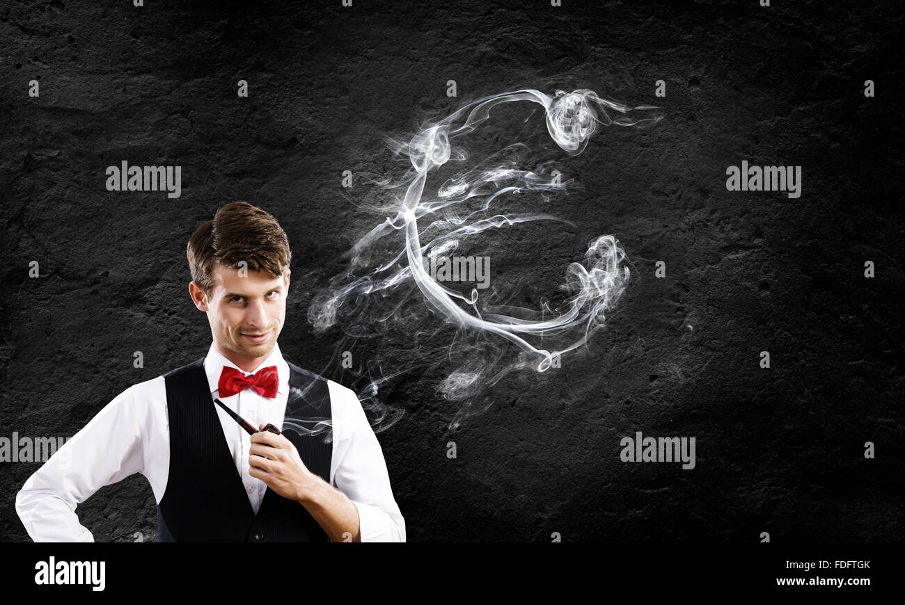 Bel giovane imprenditore tubo di fumo. Fare Soldi Foto Stock