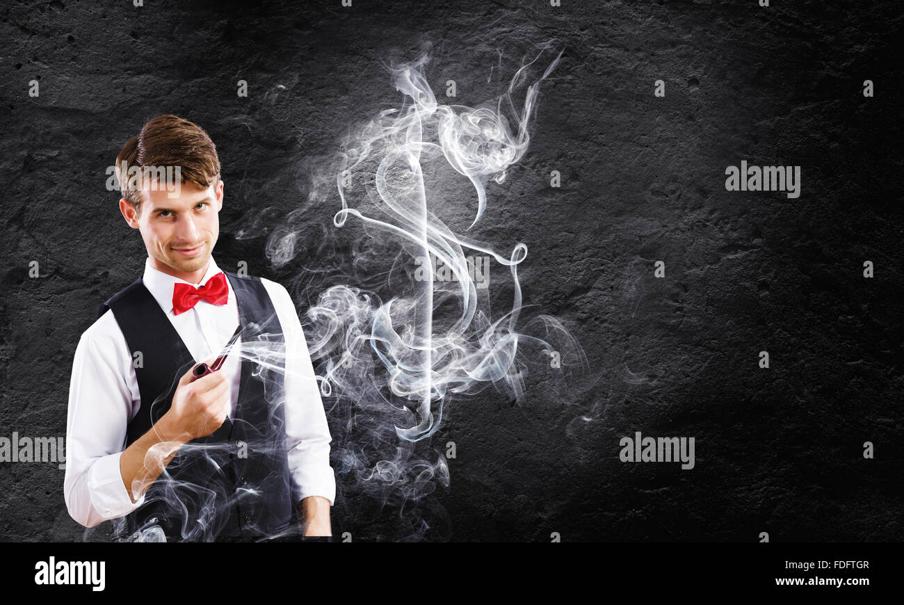 Bel giovane imprenditore tubo di fumo. Fare Soldi Foto Stock