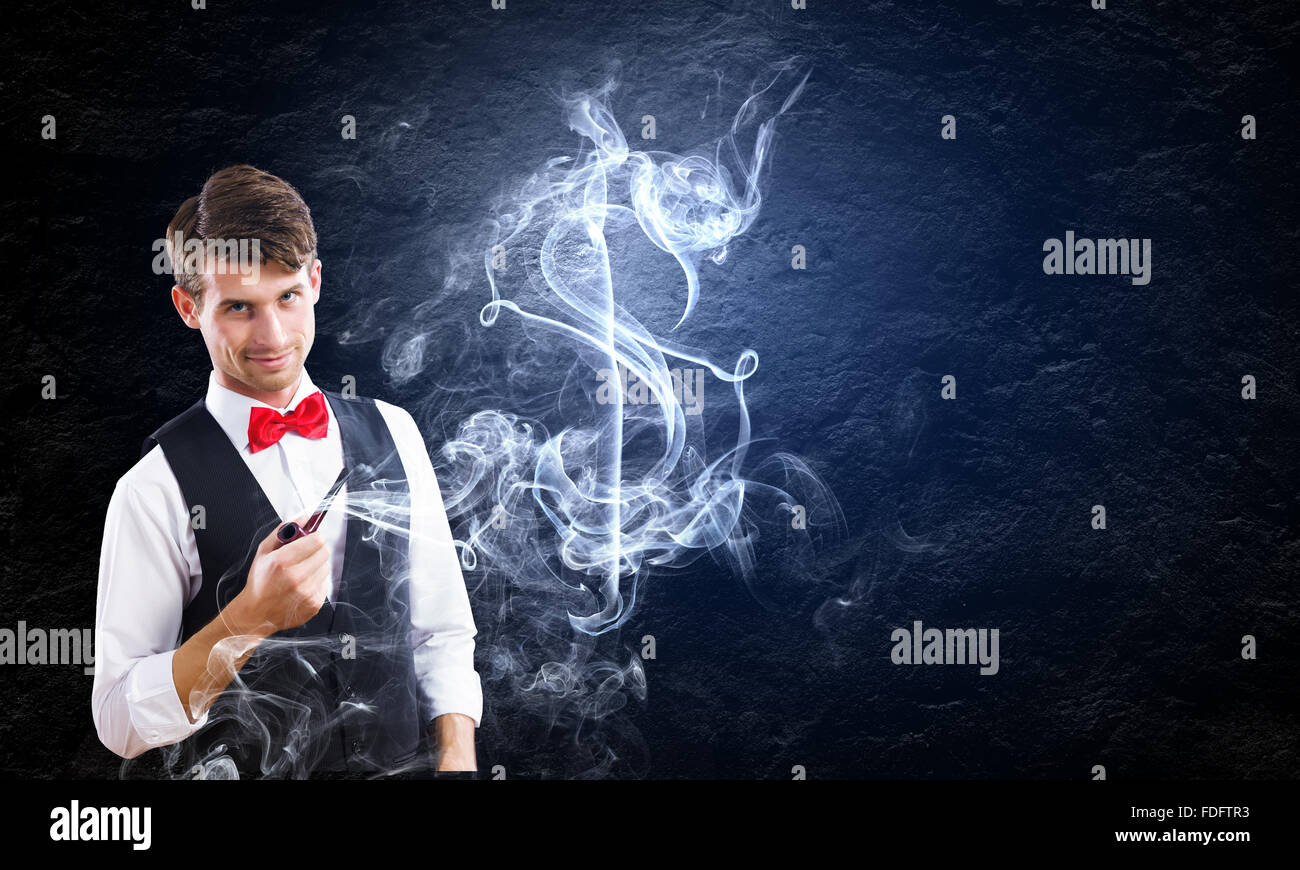 Bel giovane imprenditore tubo di fumo. Fare Soldi Foto Stock